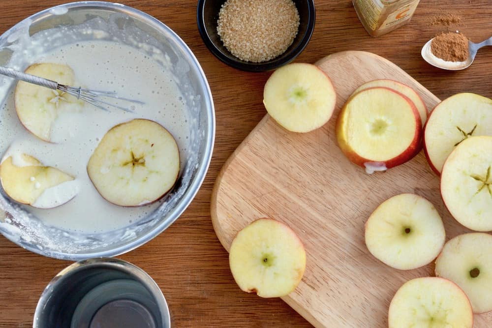 Placing the apple slices in the batter
