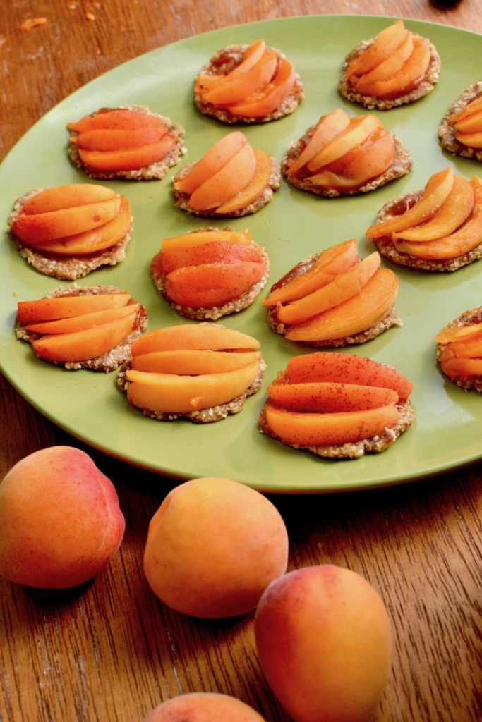 Thin slices of apricot on the mini tarts