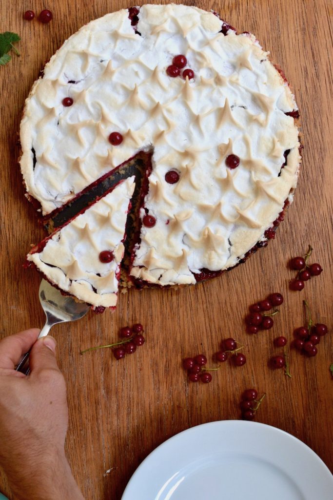 Cutting a piece of the vegan redcurrant tart