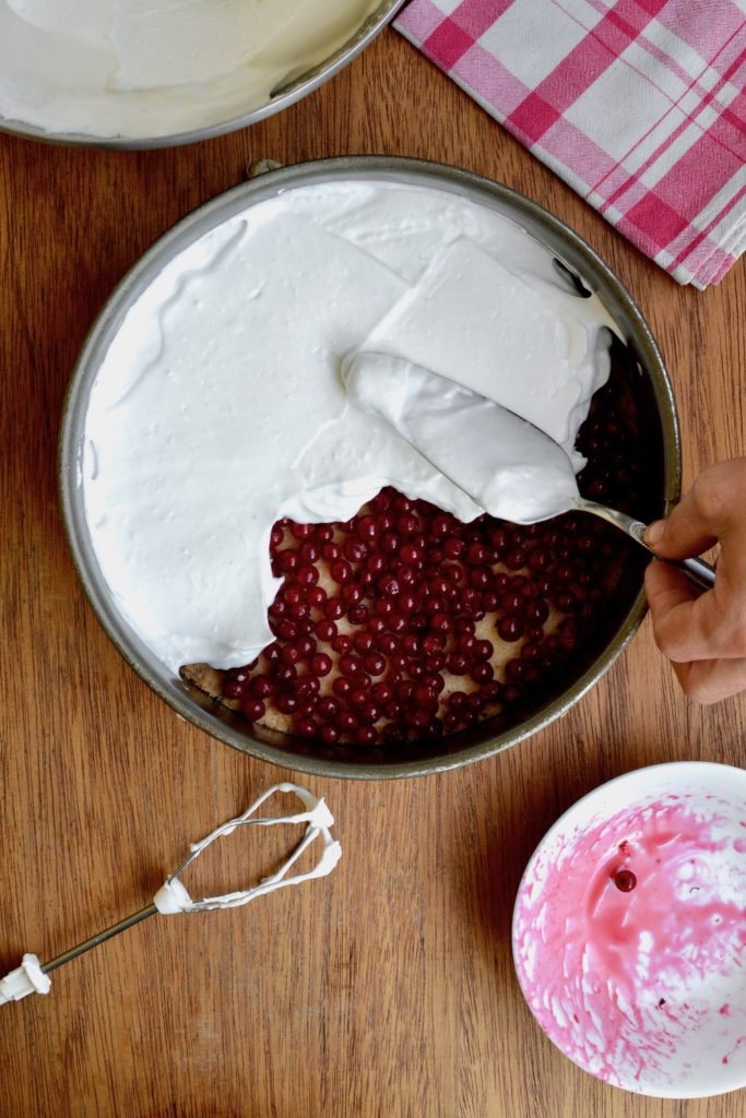Covering the redcurrants with the aquafaba meringue