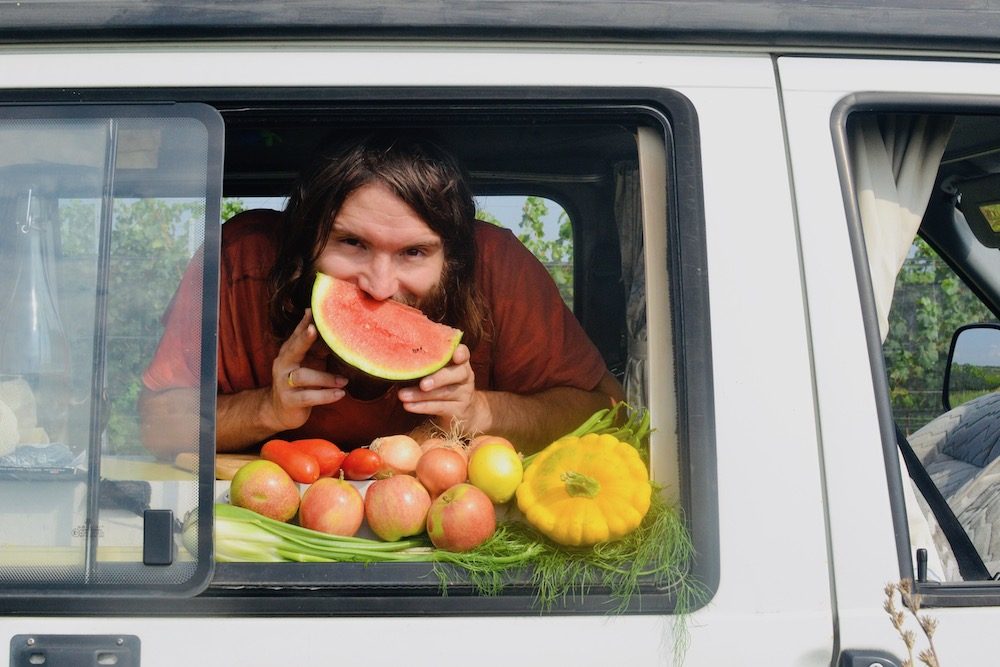 Paul holds a watermelon slice like a smile