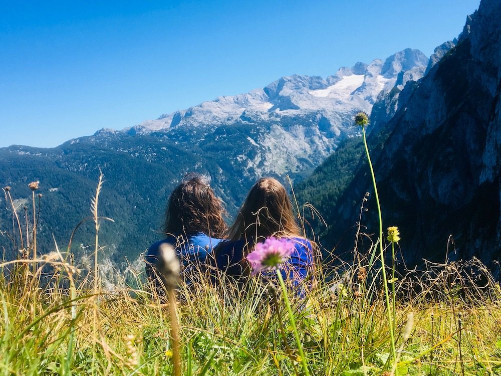 Sitting in a flowery meadow in the Alps