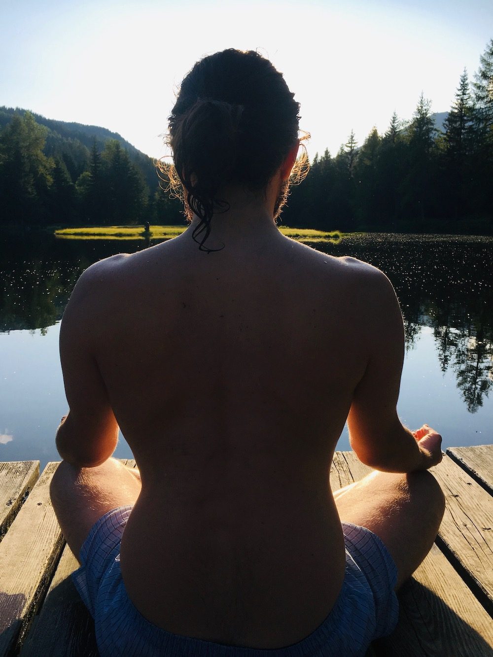 Paul meditating by a lake