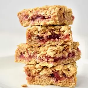 A stack of four squares of PBJ oat bars