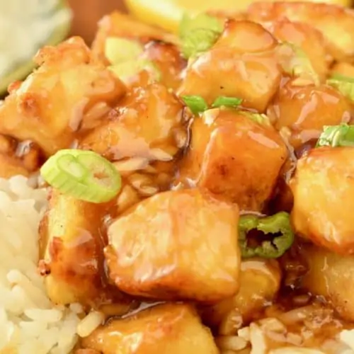 Cubes of tofu coated in a sticky lemon sauce
