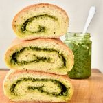 Three chunks of fluffy, pesto filled bread stacked on top of eachother