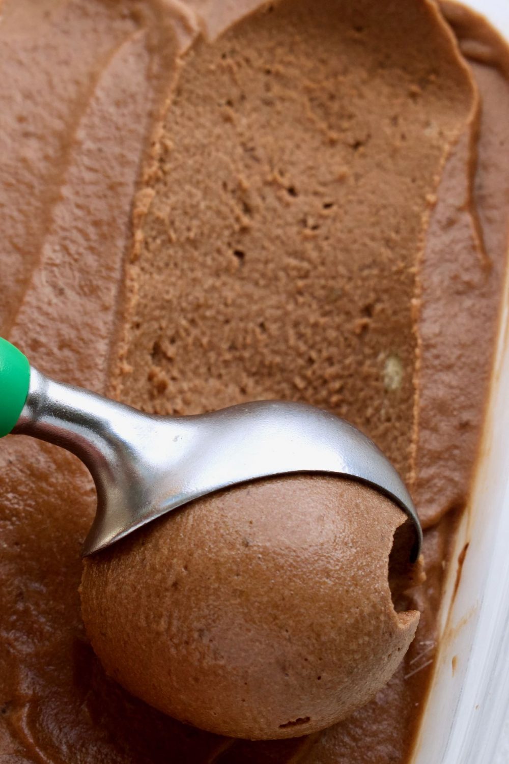 Scooping out a scoop of chocolate nice cream