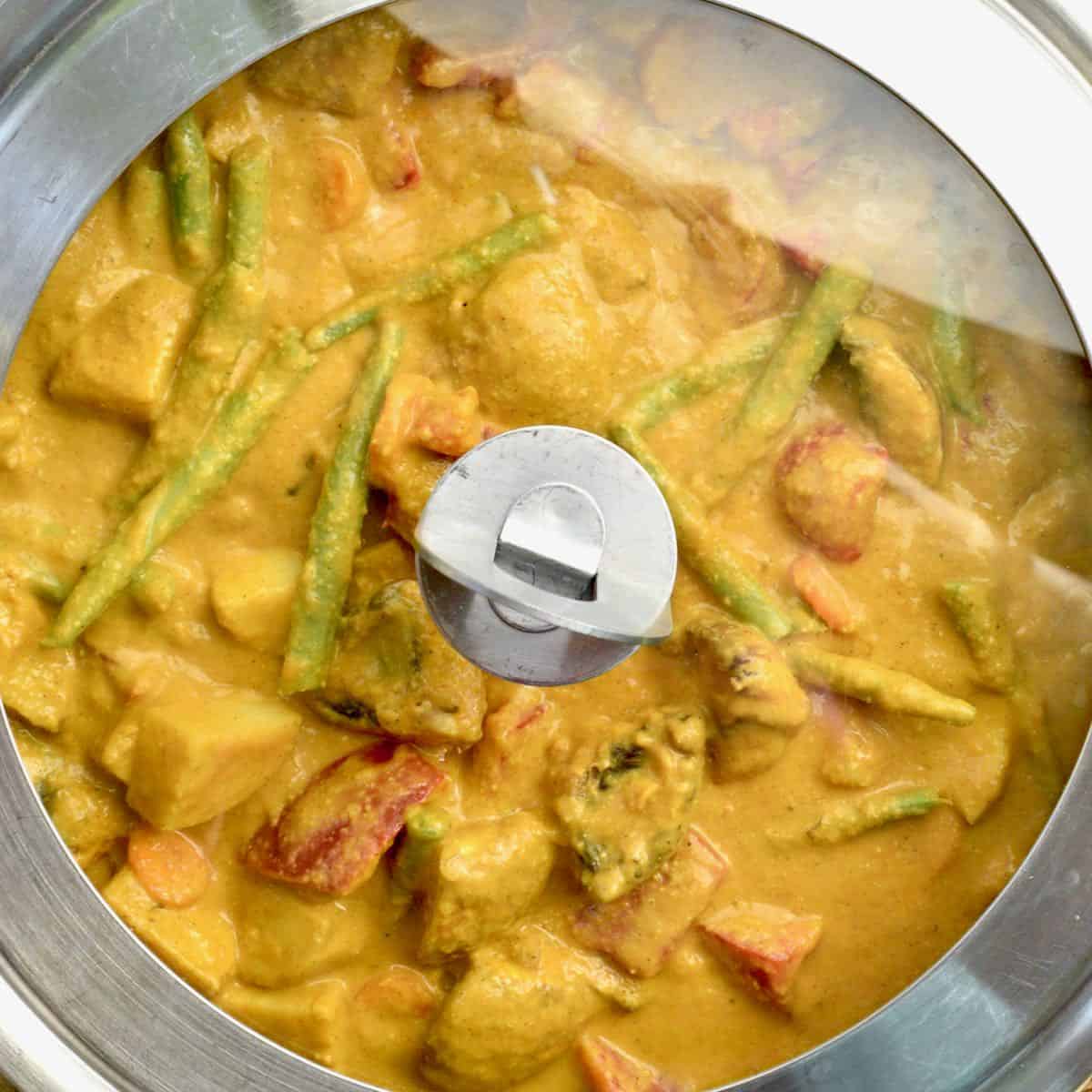 The pan is covered with a lid whilst the vegetables cook.