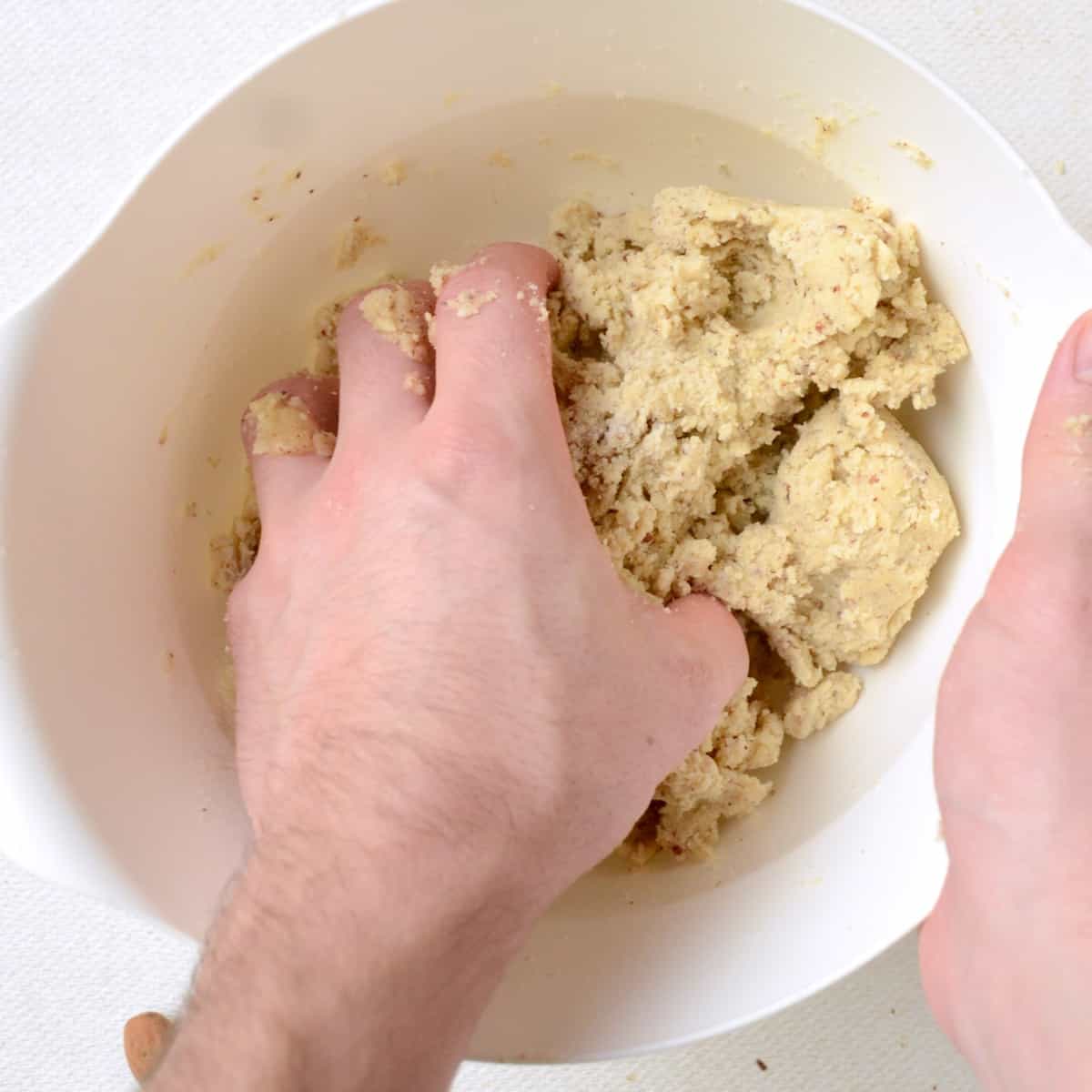 The dough ingredients are first mixed with a spoon or fork, and then kneaded by hand into a firm dough.