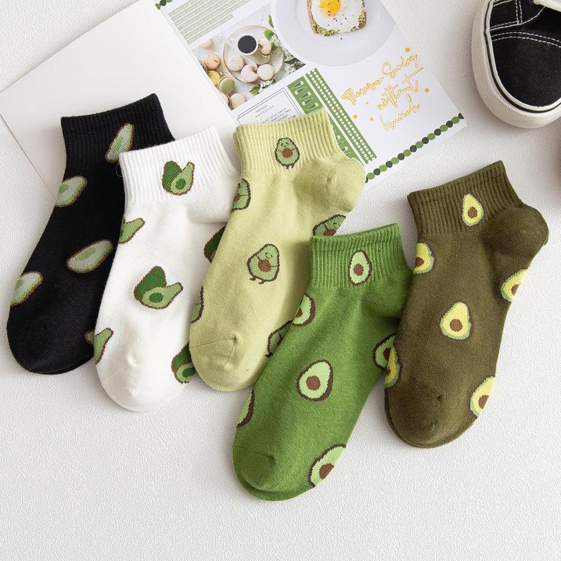 Socks in various colours with avocado prints.