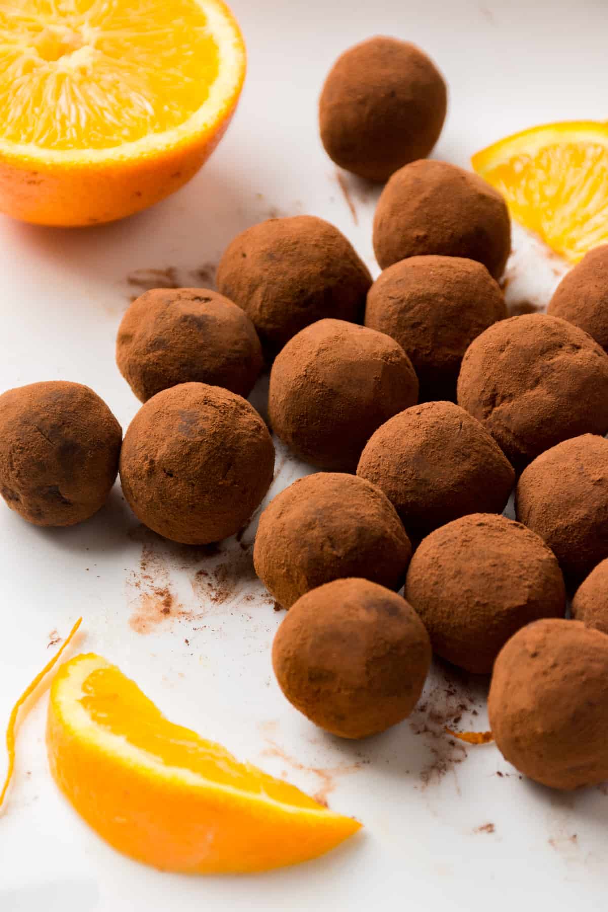A dozen or more chocolate orange truffles.