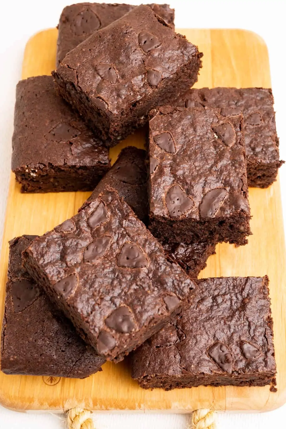 From above you can see the shiny top of the brownies on a serving board.