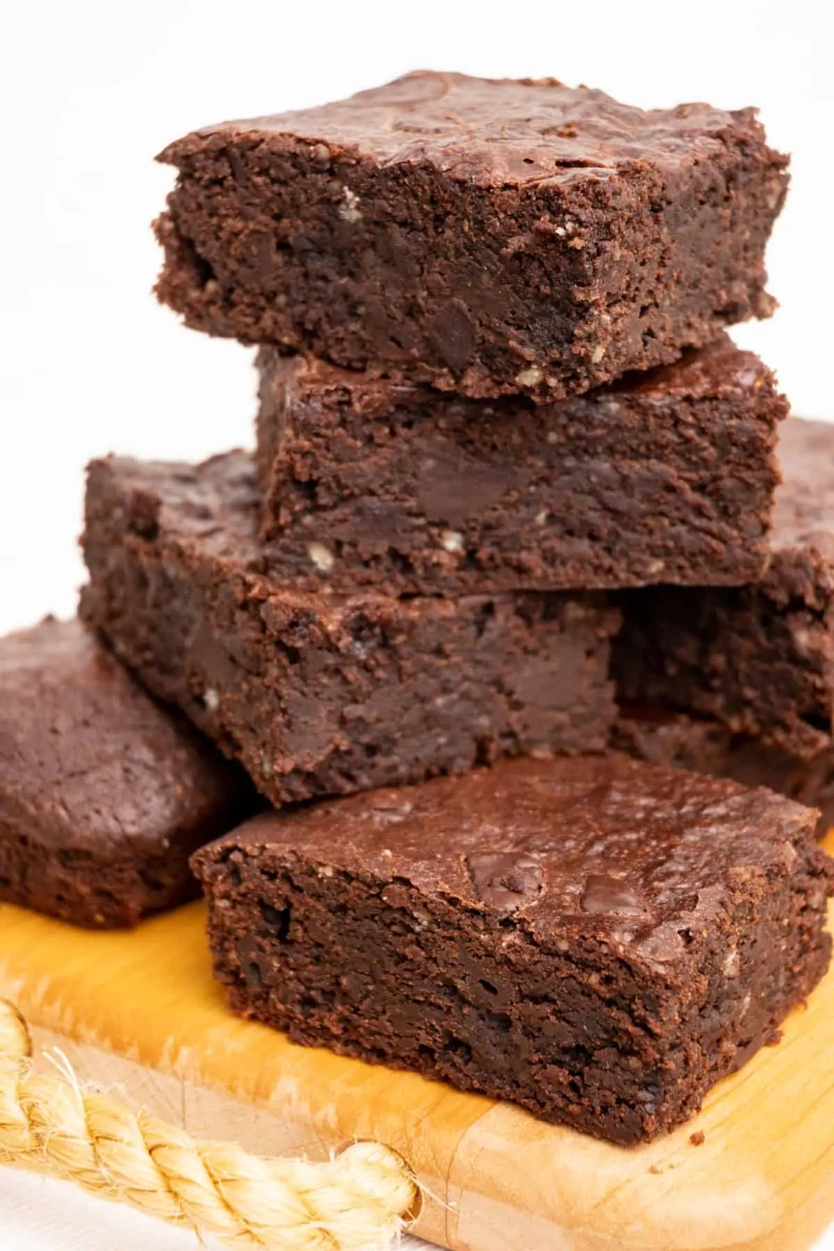 A stack of homemade vegan brownies ready to be eaten.
