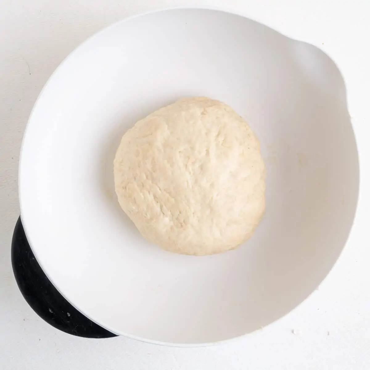 A ball of dogh in a mixing bowl.