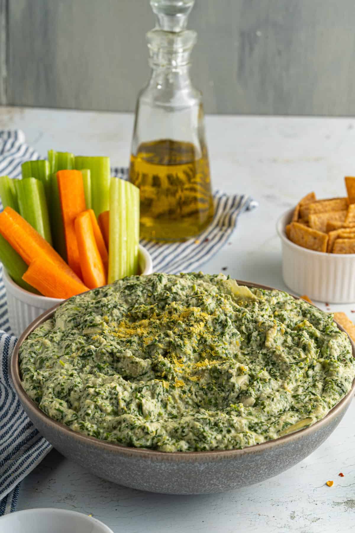 A bowl of vegan spinach and artichoke dip.