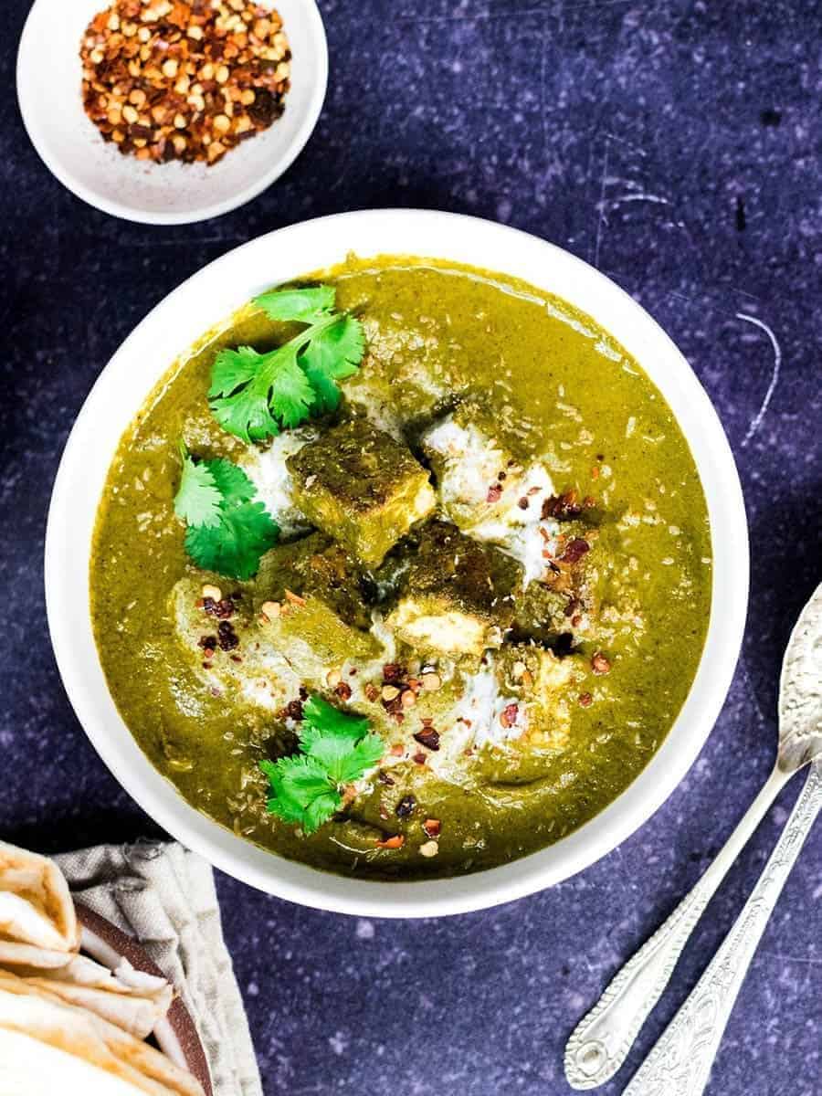 A bowl of vegan spinach and tofu curry.