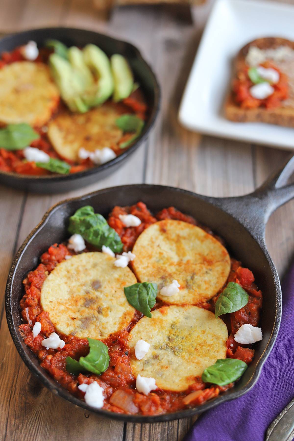 A skillet with vegan shakshuka and tofu on top.