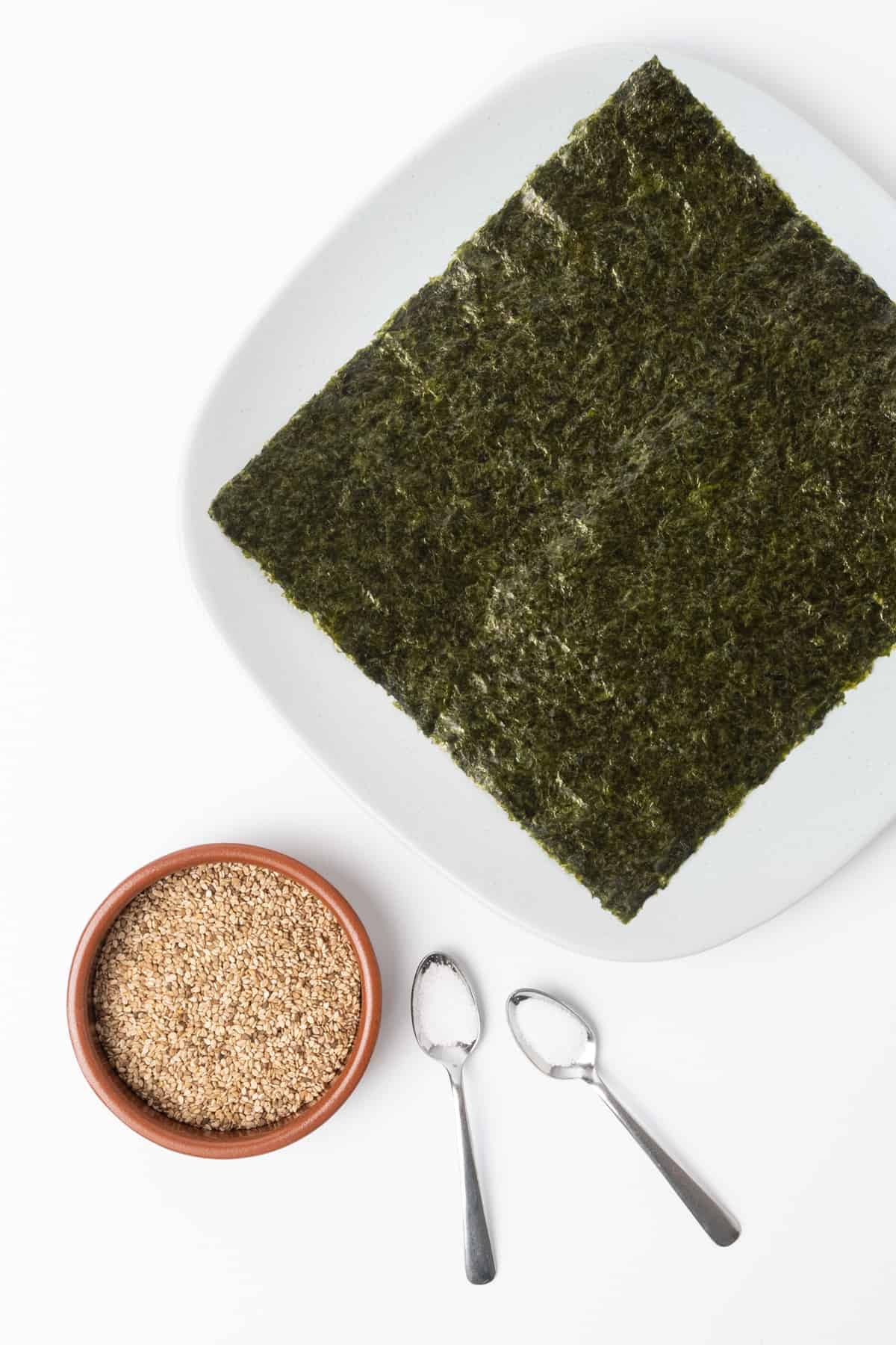 Ingredients of a simple furikake seasoning: sesame seeds, nori seaweed, sugar and salt.