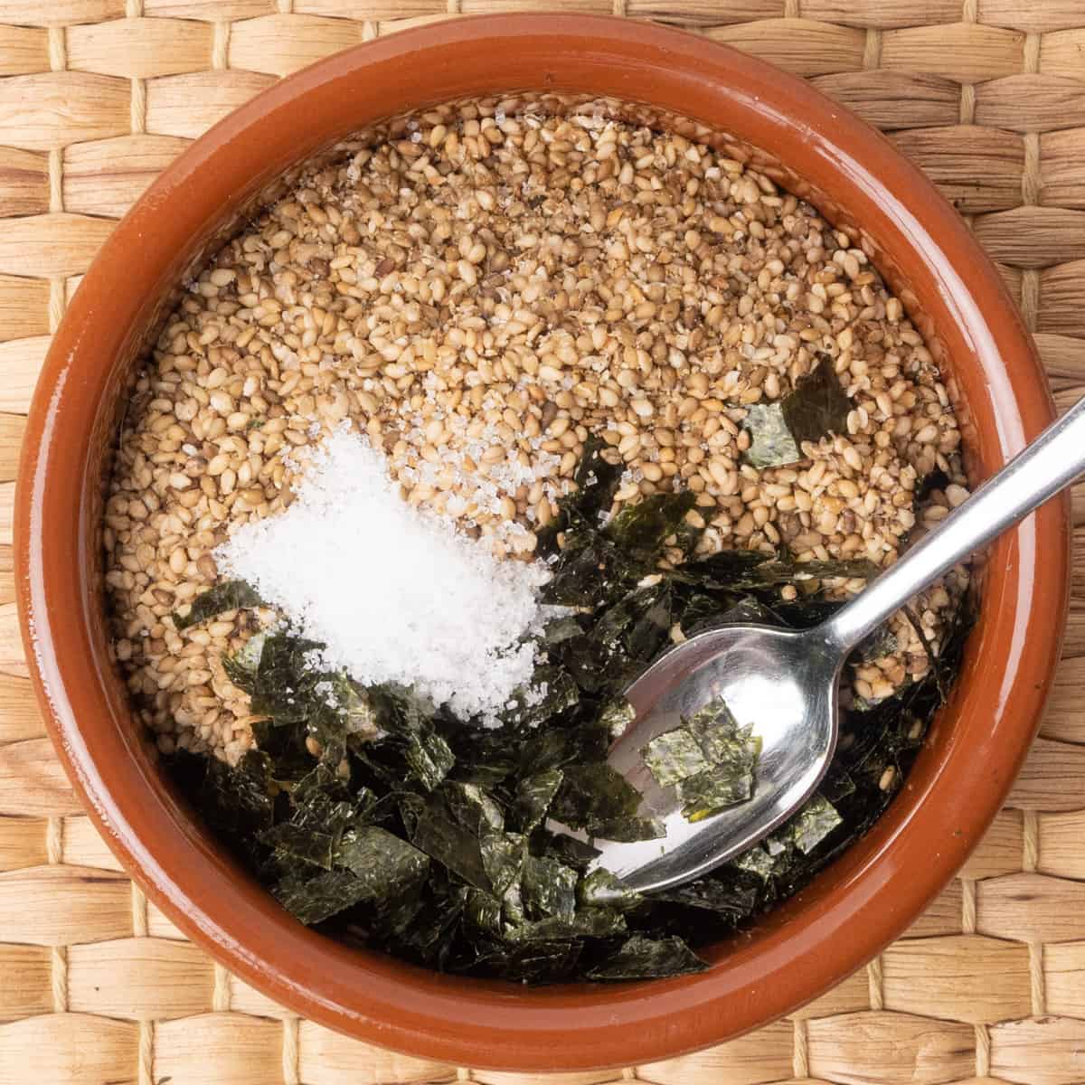 toasted sesame seeds and seaweed flakes combined with a pinch of sugar and salt to make furikake seasoning.