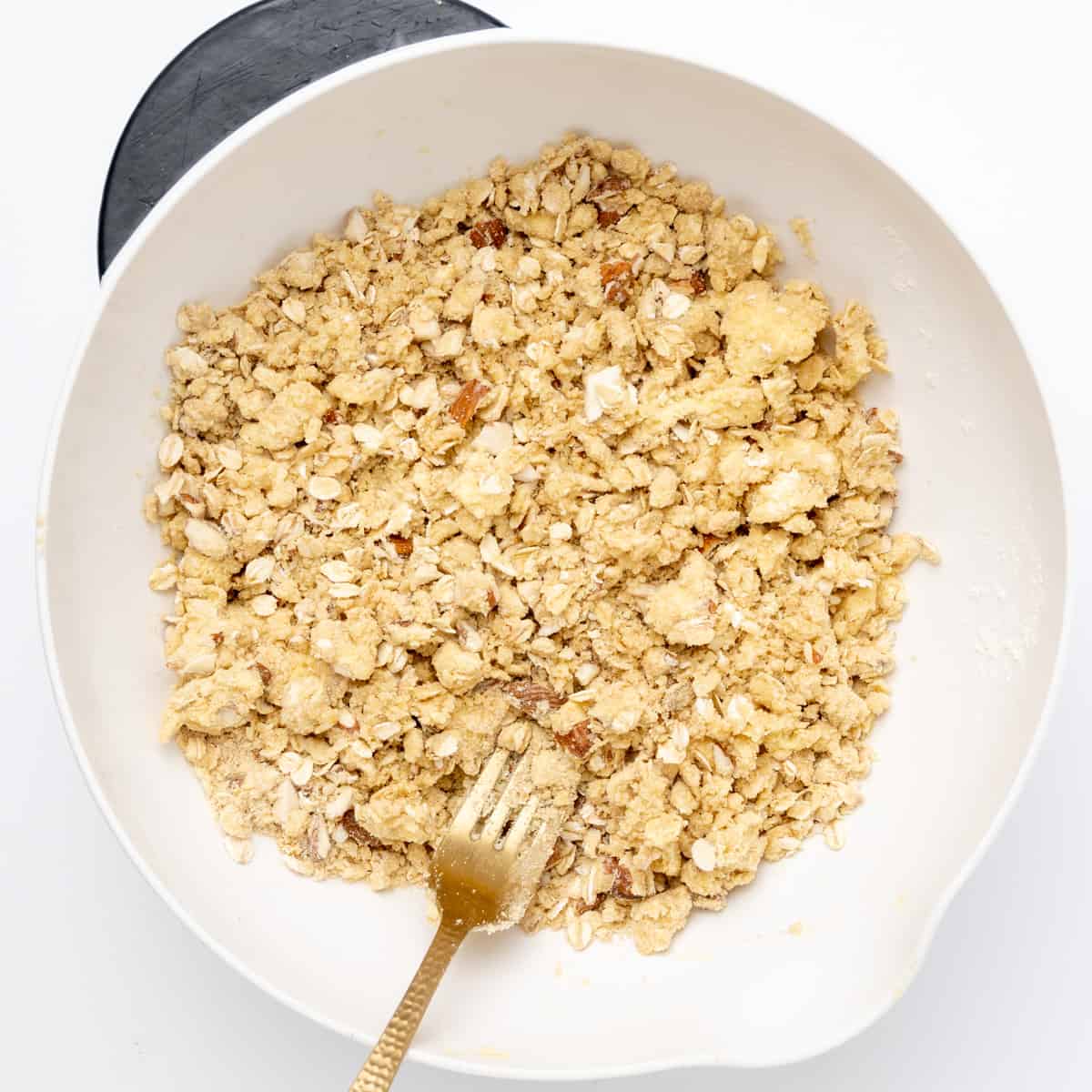 The crisp topping still is mixed together in a bowl.
