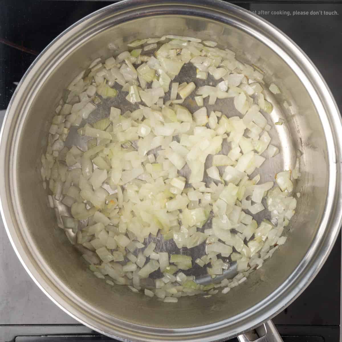 Diced onions in a saucepan.