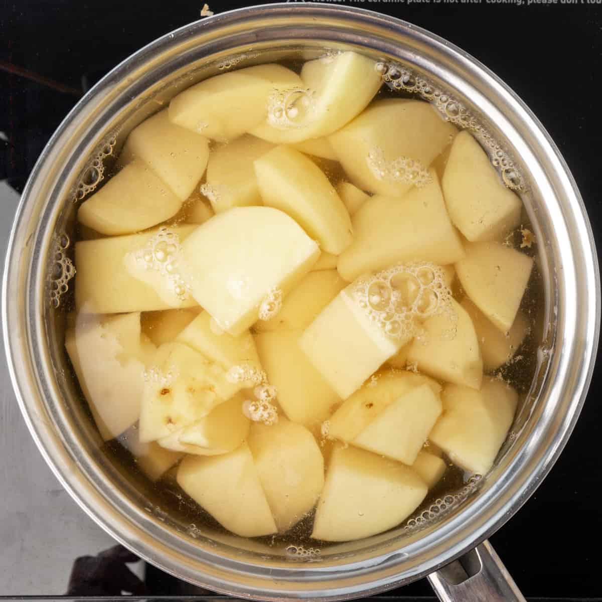 Potatoes simmering on the hob.