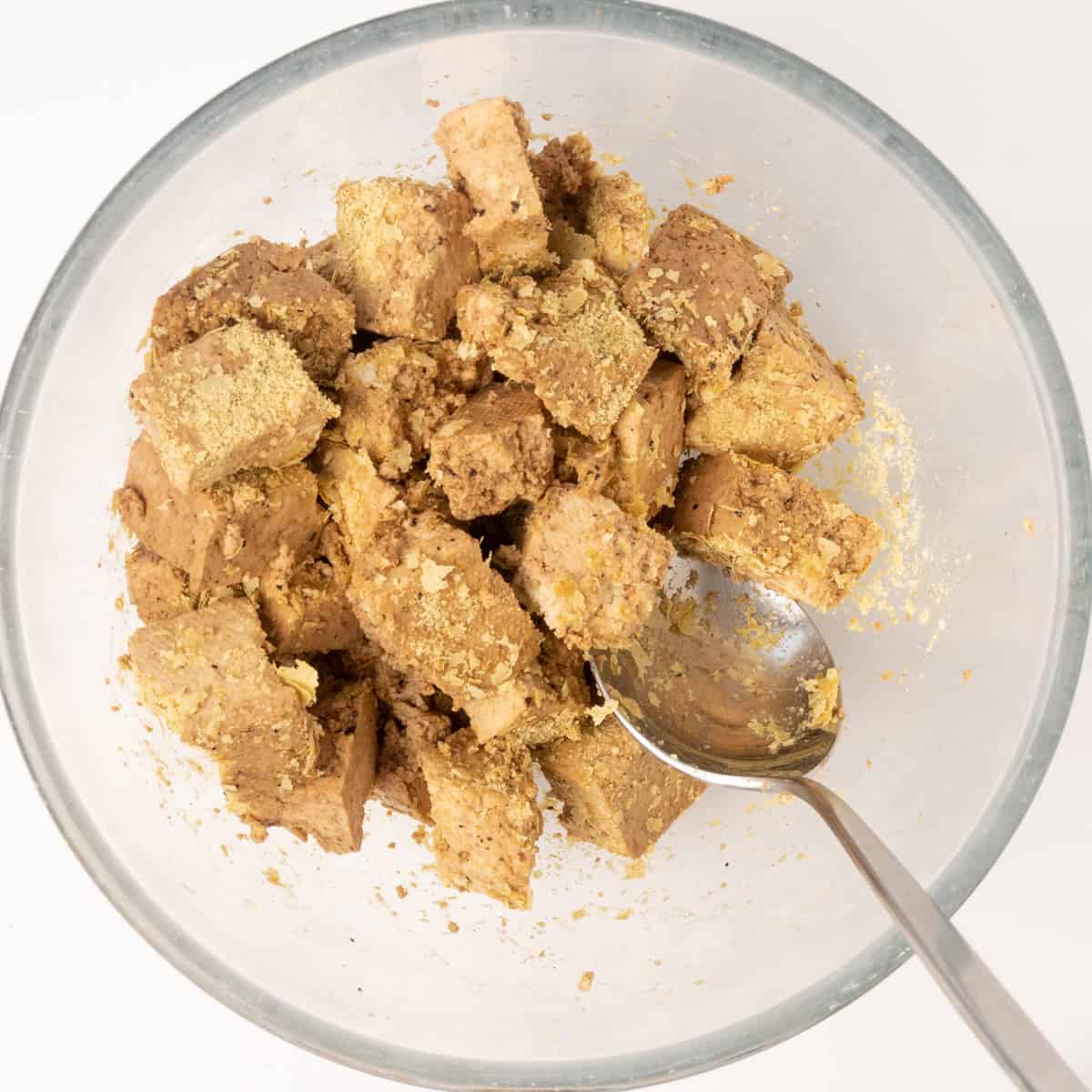Tofu cubes seasoned with soy sauce, salt, pepper and yeast flakes.
