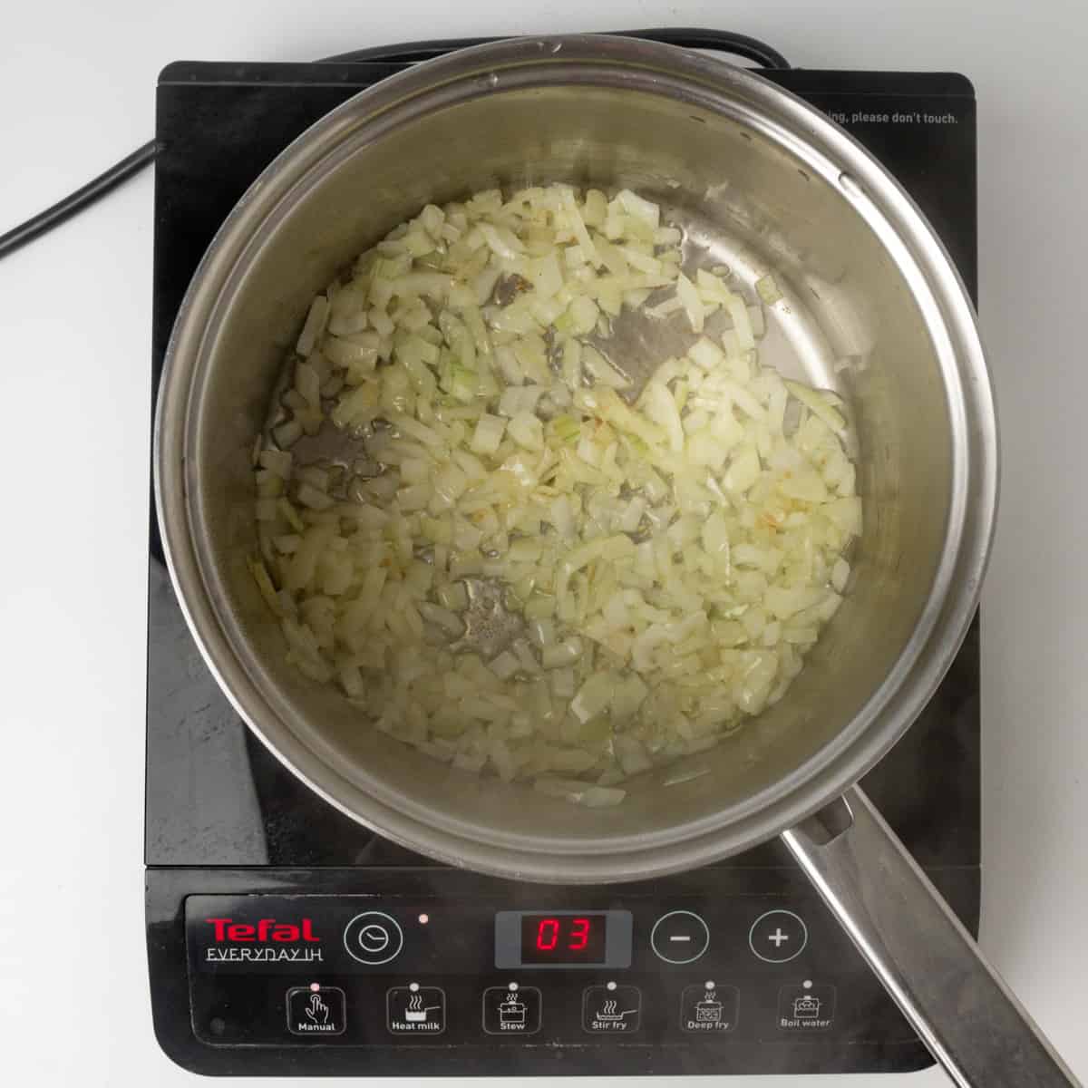 Sauteing onions in a sauce pan.