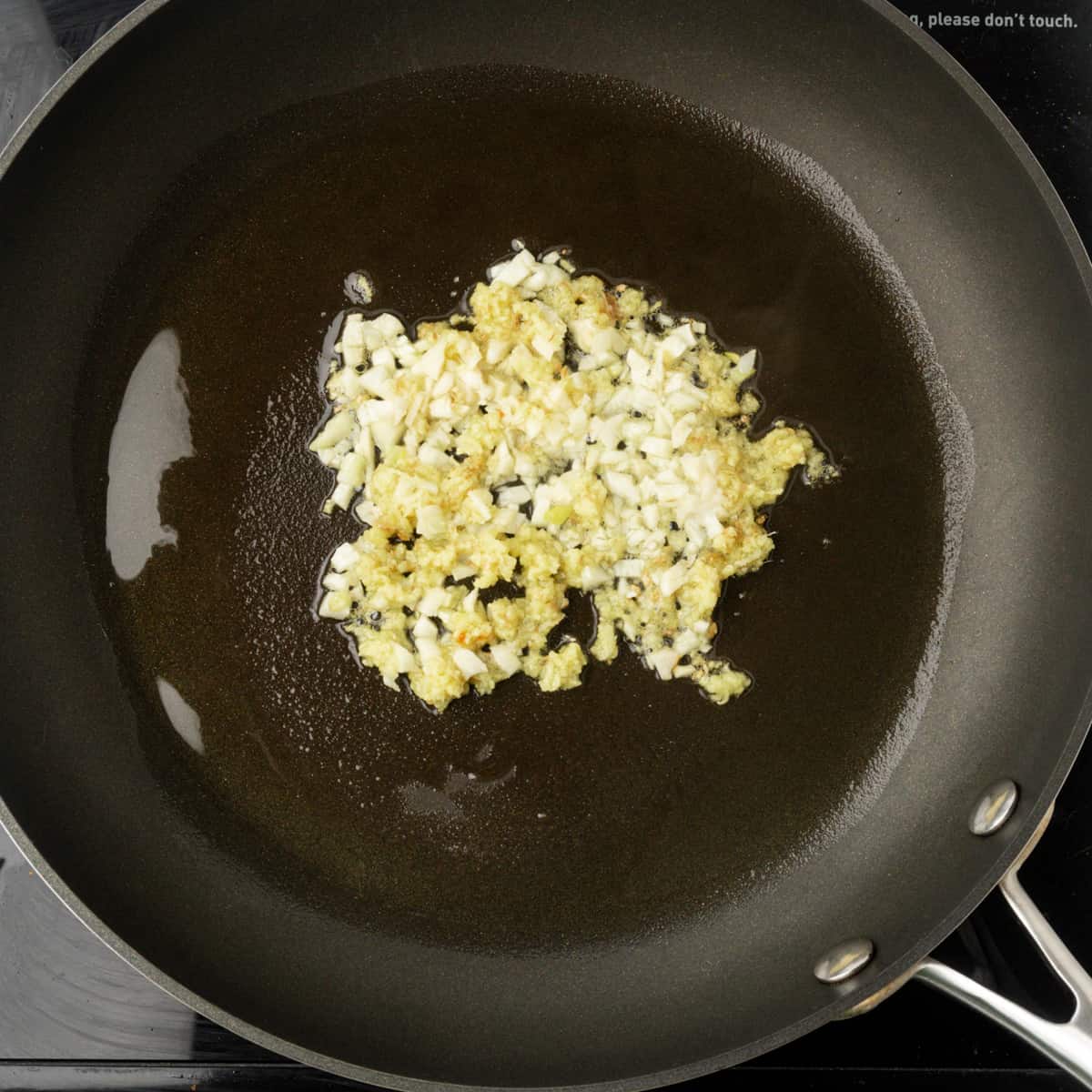 Ginger and garlic frying in oil.